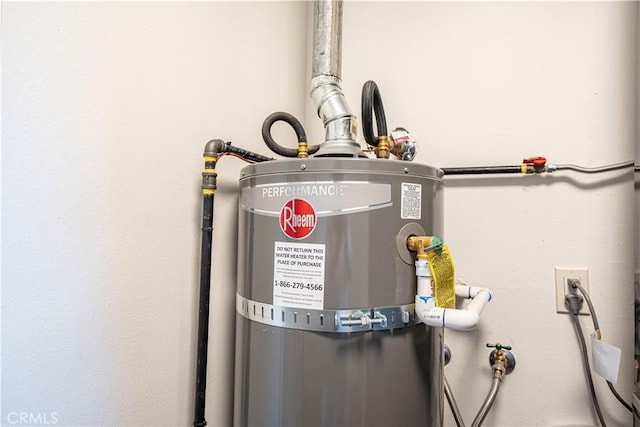 utility room featuring gas water heater