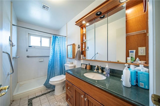 full bathroom featuring tile patterned flooring, visible vents, toilet, a stall shower, and vanity