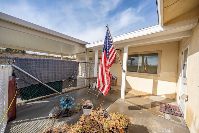 view of patio featuring fence