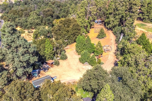 drone / aerial view featuring a view of trees