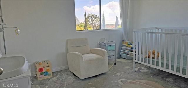 bedroom with a nursery area