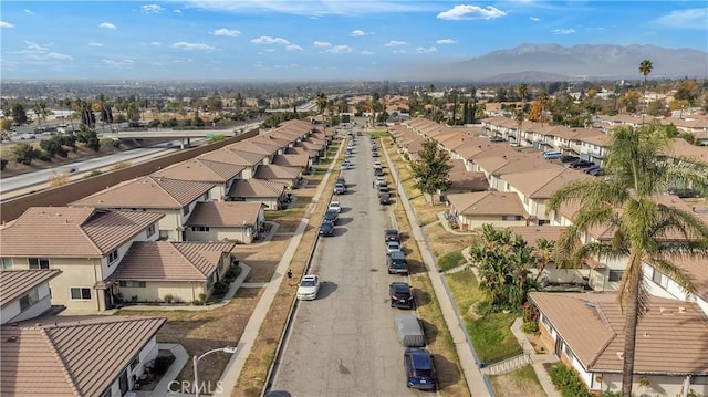 drone / aerial view with a residential view and a mountain view