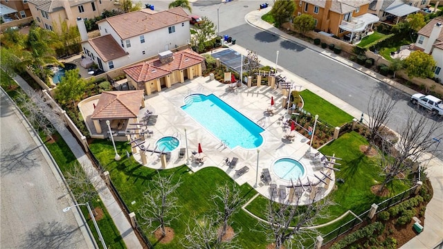 birds eye view of property with a residential view