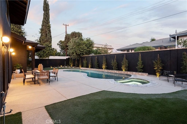 view of swimming pool featuring a fenced in pool, a fenced backyard, a patio, and an in ground hot tub