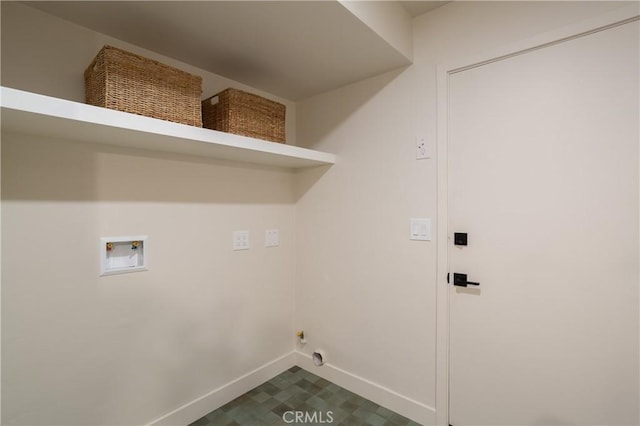 clothes washing area with laundry area, baseboards, dark floors, and washer hookup