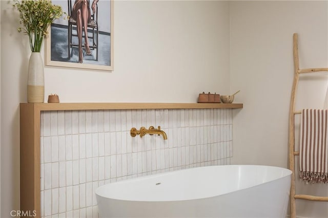 full bathroom featuring radiator, a freestanding tub, and a sink