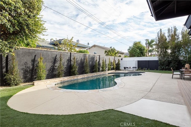 view of pool featuring a fenced backyard, a fenced in pool, and a patio