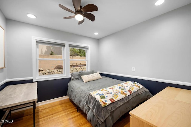 bedroom featuring recessed lighting, wood finished floors, a ceiling fan, and baseboards