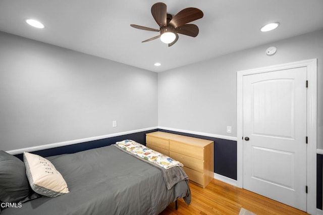 bedroom with baseboards, light wood-style flooring, and recessed lighting