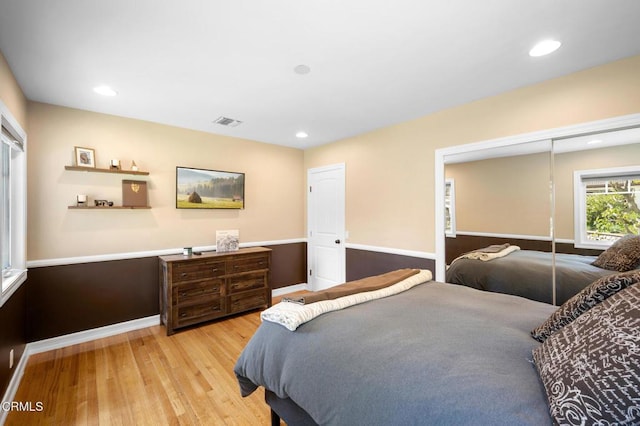 bedroom with recessed lighting, a closet, visible vents, light wood-type flooring, and baseboards