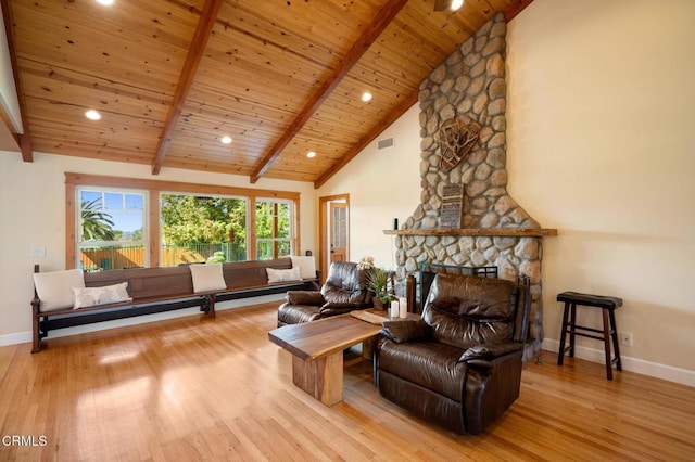 sitting room featuring baseboards, wood ceiling, wood finished floors, beamed ceiling, and a fireplace