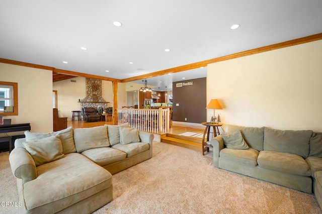 carpeted living room with ornamental molding, recessed lighting, and baseboards