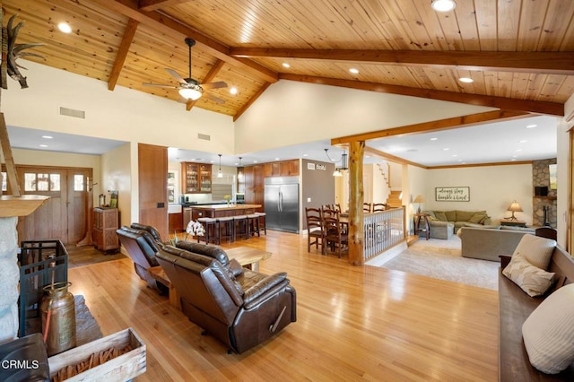 living area featuring wood ceiling, visible vents, stairway, beam ceiling, and light wood finished floors