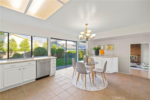 dining room with light tile patterned floors and a chandelier