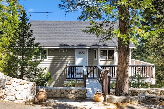 view of front of house with a shingled roof