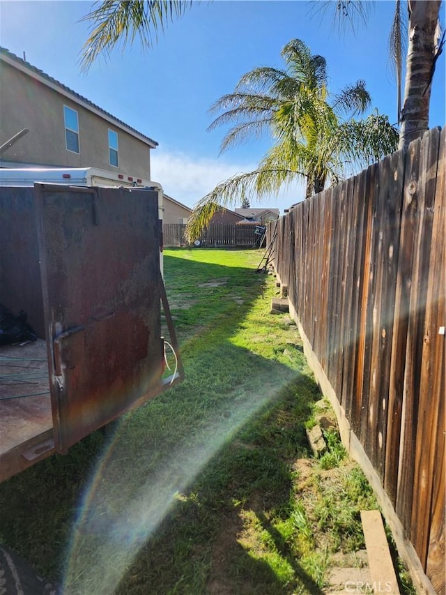 view of yard with a fenced backyard