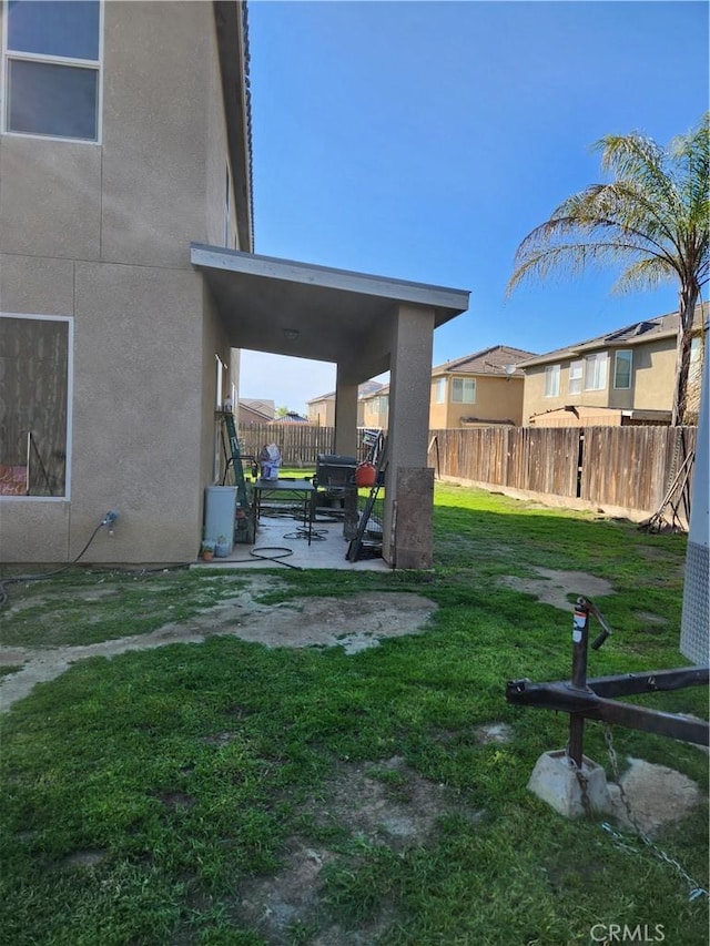 view of yard with a patio area and fence