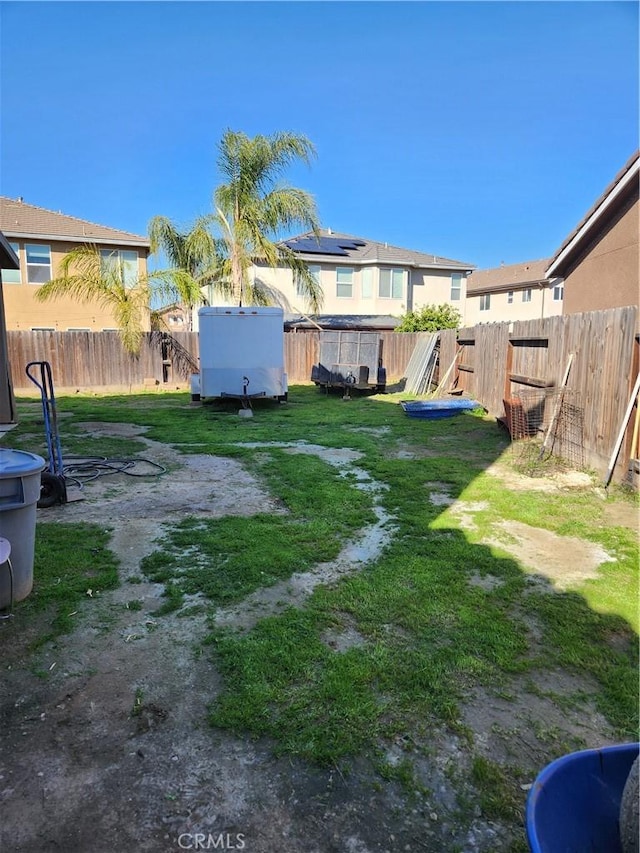 view of yard with a fenced backyard