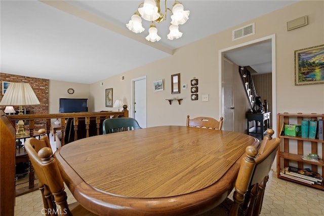 dining room with visible vents and an inviting chandelier