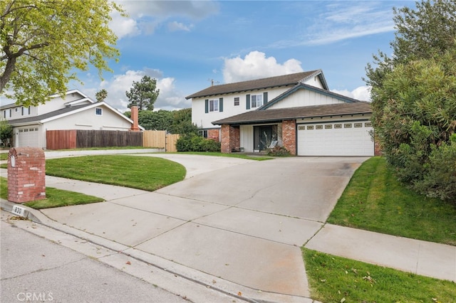 traditional home with an attached garage, brick siding, fence, driveway, and a front lawn