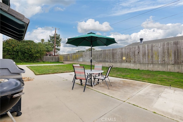 view of patio / terrace featuring a fenced backyard, outdoor dining area, and grilling area