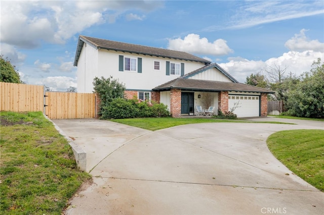 traditional-style home with an attached garage, brick siding, fence, driveway, and a gate