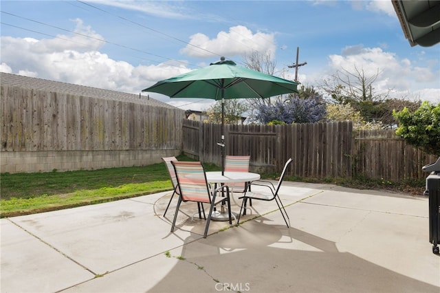 view of patio / terrace with outdoor dining area and a fenced backyard