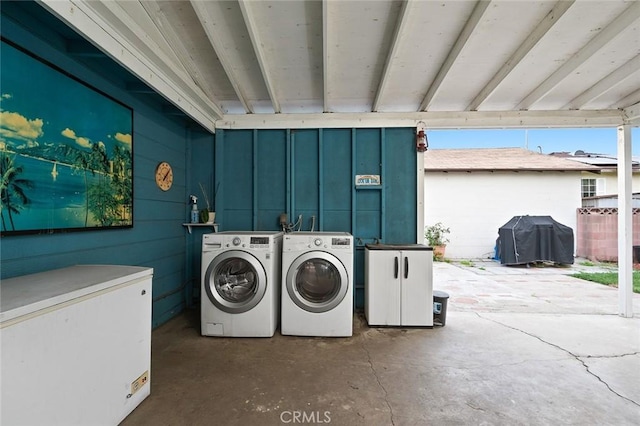 laundry area featuring laundry area and washing machine and clothes dryer