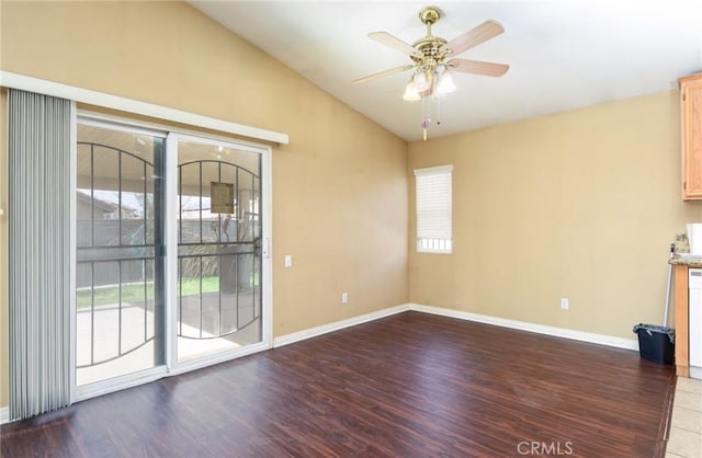 interior space featuring vaulted ceiling, wood finished floors, a ceiling fan, and baseboards