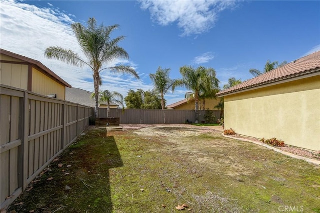 view of yard with a fenced backyard