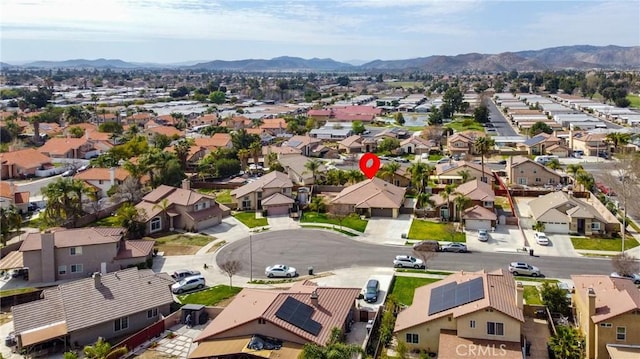 drone / aerial view with a residential view and a mountain view