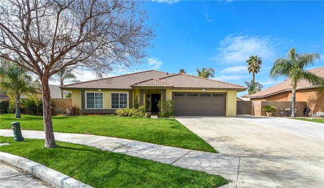 ranch-style house with a garage, fence, driveway, a tiled roof, and stucco siding