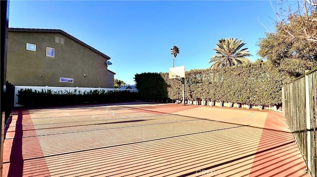 view of sport court with community basketball court and fence