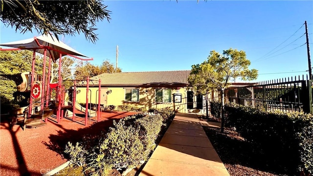 communal playground featuring fence