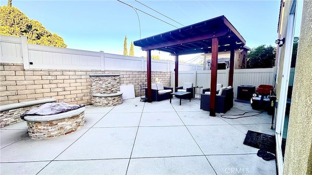 view of patio with a fenced backyard and an outdoor living space