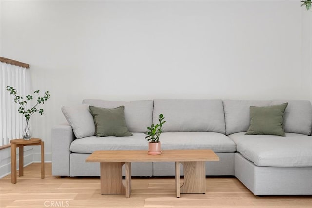 living room with light wood-style floors and baseboards