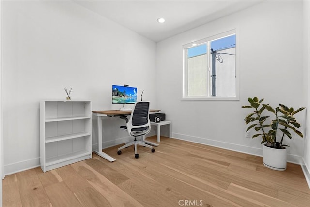 office area with recessed lighting, baseboards, and wood finished floors