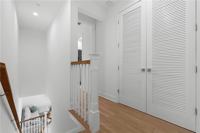 corridor with recessed lighting and light wood finished floors