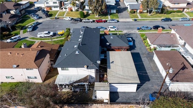 birds eye view of property with a residential view