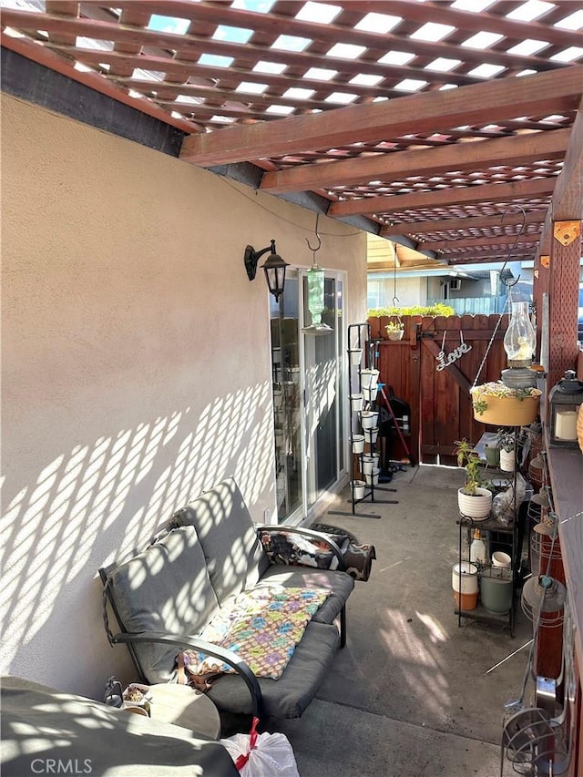 view of patio / terrace with fence and a pergola