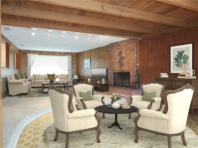 carpeted living area featuring visible vents, wood walls, beam ceiling, a fireplace, and wooden ceiling