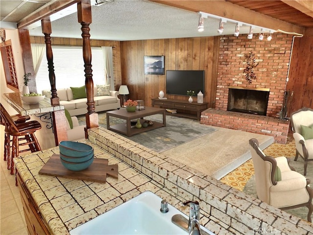 view of patio / terrace with an outdoor living space with a fireplace