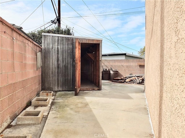 view of shed featuring a fenced backyard