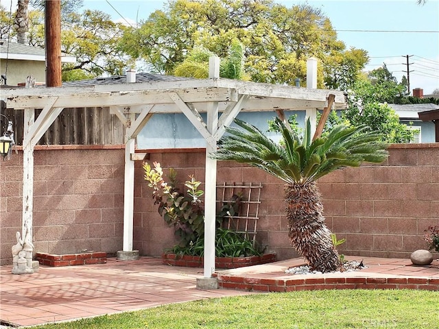 exterior space with a patio and fence