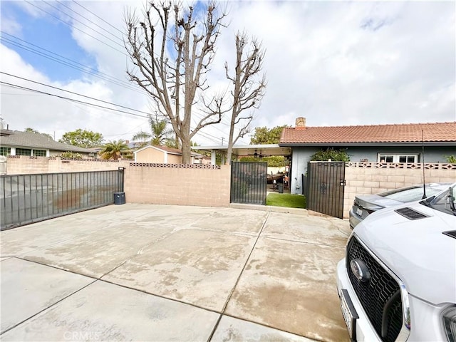 exterior space with fence private yard and a gate