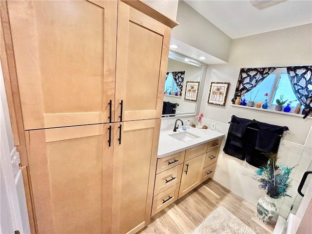 bathroom featuring vanity and wood finished floors