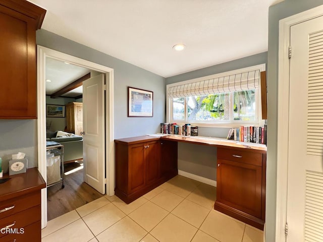 home office featuring light tile patterned floors, built in desk, and recessed lighting