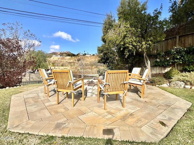 view of patio / terrace featuring fence