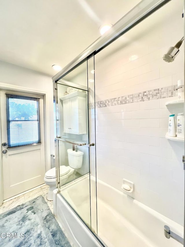 full bath with combined bath / shower with glass door and toilet