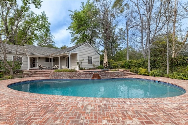 outdoor pool featuring a patio area